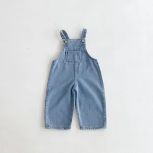 Baby light blue denim overalls detail, featuring a cute chest pocket and metal button straps.