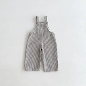 Detailed view of casual black and white striped baby bib overalls for daily comfortable wear.