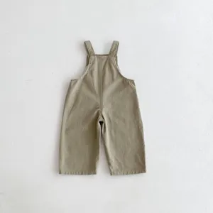 Detail view of khaki toddler overalls, comfortable cotton casual jumpsuit for baby boys and girls.
