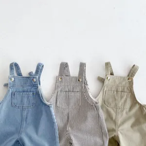 Detailed view of casual infant children dungarees, cozy cotton and denim straps details.