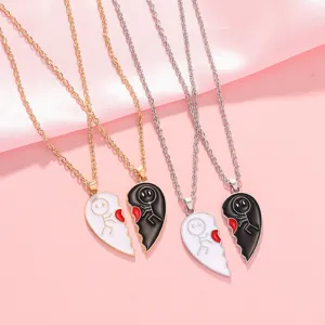 Couple matching heart pendant necklace set featuring enamel stick figure design for friends.