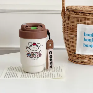 Closeup of the cute puppy insulated coffee mug with brown lid and handy strap on table.