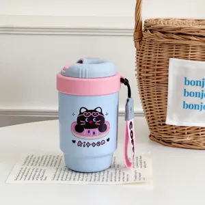 Mini portable thermos coffee cup with cute black cat pattern, pastel blue and pink design.