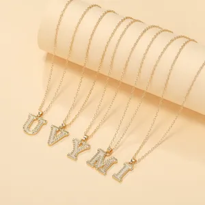 Gold plated capital letter pendant necklace fashion jewelry detail view for women.