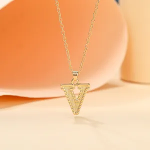 Gold plated letter V pendant necklace detail showcasing the delicate metallic chain and shiny finish.