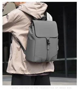 Minimalist grey casual backpack for men, large capacity business commuting computer bag.
