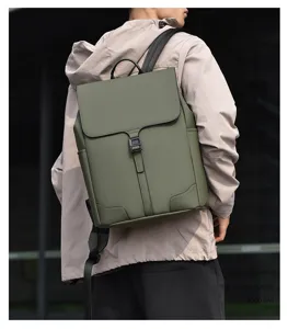 Detailed view of the dark green men's casual business backpack with flap closure and straps.