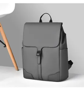 Minimalist grey backpack detail, featuring clean matte finish, secure flap and front buckle.