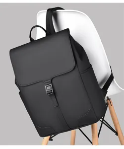 Waterproof black minimalist business casual backpack detail view, durable daily commuter laptop bag.