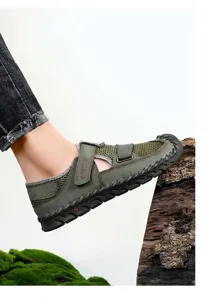 Close-up of green men's beach sandal with breathable mesh and hand-stitched sole