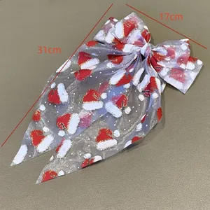 Large Christmas bow hair clip with Santa hat print mesh fabric for holiday parties 31cm