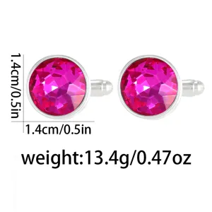 Detailed shot of round fuchsia crystal cufflinks with silver metal setting and sizing.