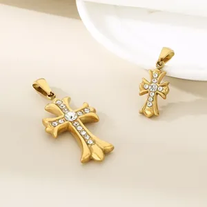 Detail view of gold stainless steel cross pendant with sparkling rhinestones, elegant jewelry.