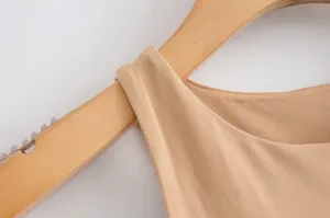 Close-up detail of women solid ribbed sleeveless bodysuit shoulder and neckline craftsmanship.
