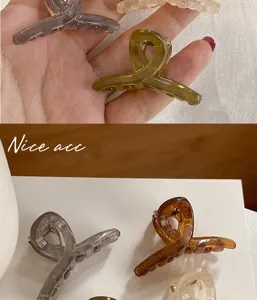 Mini translucent hair claw clips detail shot, showcasing assorted colors for cute daily hairstyles.