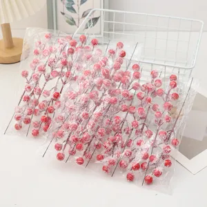 Frosted artificial red berry branches detail, perfect for DIY Christmas floral arrangements and decor.