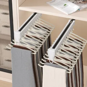 Pull-out trouser rack for wardrobe, space-saving pants hanger and closet organizer rail system.
