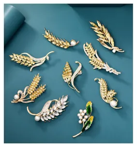 Elegant wheat brooch set featuring sparkling zircon and pearls, chic gold-plated suit pin accessory.