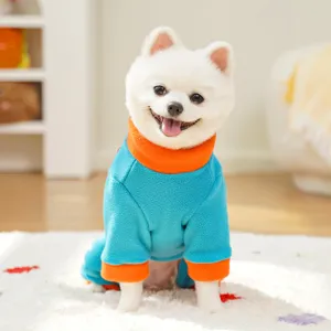 Detail view of pet fleece jumpsuit in blue and orange, cozy winter dog clothes with mock neck.