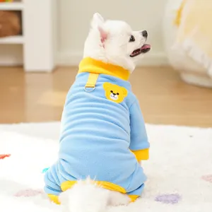 Cute fleece pet jumpsuit with warm color-blocking and bear patch detail for autumn and winter.