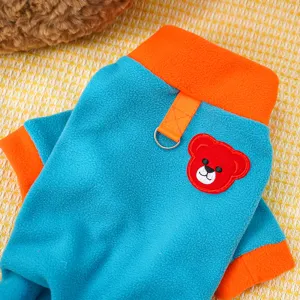 Close-up detail of blue and orange pet fleece sweater with D-ring and cute bear embroidery.