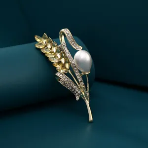 Elegant wheat ear brooch featuring sparkling yellow crystals and pearl for women.