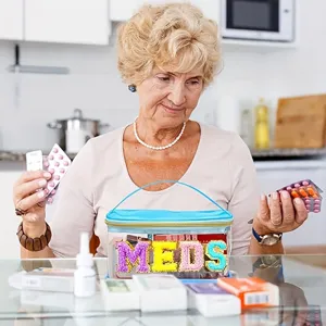 Trousse de toilette transparente en PVC avec lettres MEDS colorées pour le rangement quotidien.
