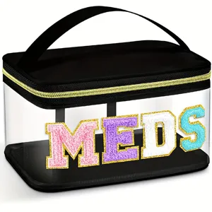 Trousse de toilette transparente en PVC avec lettres MEDS colorées et poignée.
