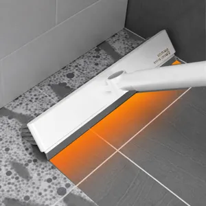 Long handle floor gap cleaning brush with curved scraper for bathroom tile grout washing.