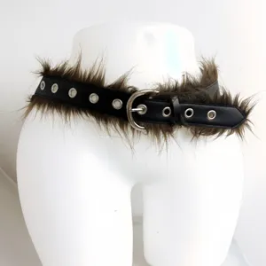 Faux fur grommet belt detail shot showing black leather and brown fluffy plush trim.