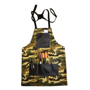 Durable canvas work apron with multiple leather tool pockets and adjustable straps for woodworkers.