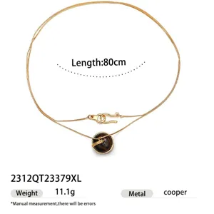 Elegant 18k gold plated long chain necklace with round stone pendant for women fashion.