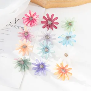 Artificial small daisy silk flower heads for DIY craft boxes, apparel accessories, and decor.