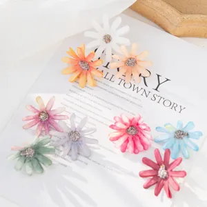 Colorful small daisy silk flower heads for DIY crafts, wedding home decor and accessories.