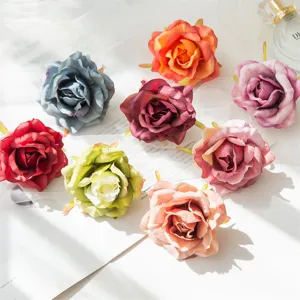 Colorful artificial rose flower heads for wedding home decoration and DIY craft projects detail view