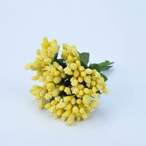 Detail shot of yellow artificial stamen berries for DIY crafts, wedding wreath and wrist flower decor.