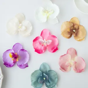 Detailed view of colorful artificial phalaenopsis orchid flower heads for DIY crafts, hairpins and decor.