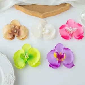 Detail view of artificial phalaenopsis orchid flower heads, multi-color DIY craft and decoration.