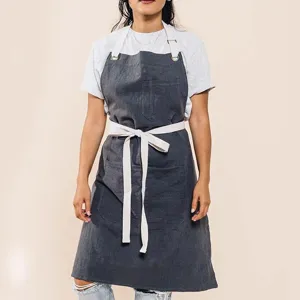 Cotton linen work apron with cross back adjustable straps and deep pockets for kitchen gardening cooking.
