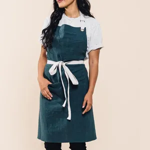 Premium cotton linen work apron with convenient front pockets, adjustable straps and durable design.