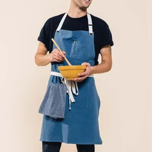 Casual linen cotton kitchen apron with pockets and adjustable straps for cooking work.