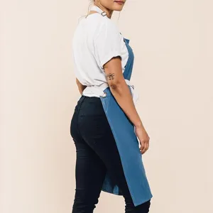Cotton linen casual work apron detail, breathable fabric with adjustable straps and metal rings.