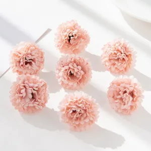 Detail shot of pink artificial silk chrysanthemum flower heads, perfect for DIY wedding crafts.