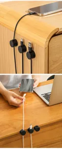 Magnetic cable organizer detail view showing neat desktop wire management and clip usage.