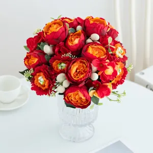 Artificial flower bouquet in glass vase, elegant red peony home table decor ornament.