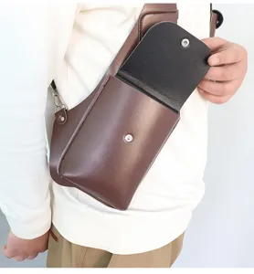 Retro brown PU leather sling bag chest crossbody holster bag for men daily travel use.