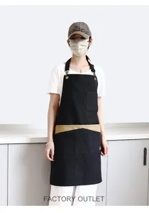 Vue détaillée d'un tablier en toile noir bicolore avec tour de cou, idéal pour salon et café.
