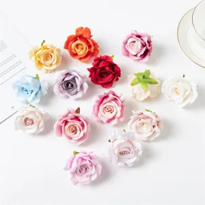 Detail view of colorful artificial rose flower heads for DIY crafts and wedding decor.