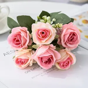 Artificial pink rose bouquet with green leaves, perfect for home tabletop and wedding decor.