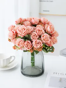 Pink artificial rose bouquet in grey glass vase, perfect for home tabletop decor detail.